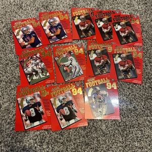 1994 Action Packed lot of 12 front cover football sheets including